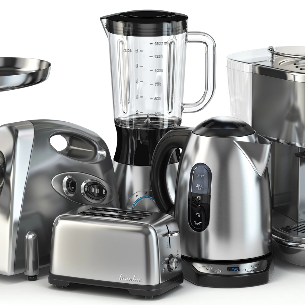 a collection of electrical kitchen appliances in black and silver on a white table